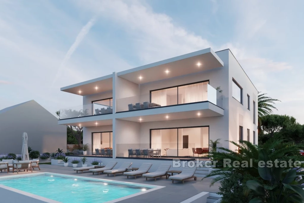 Modern apartments in a new building with a pool and a view of the sea