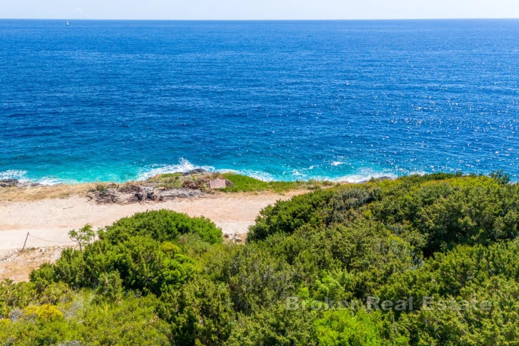 Attractive building plot, first row to the sea