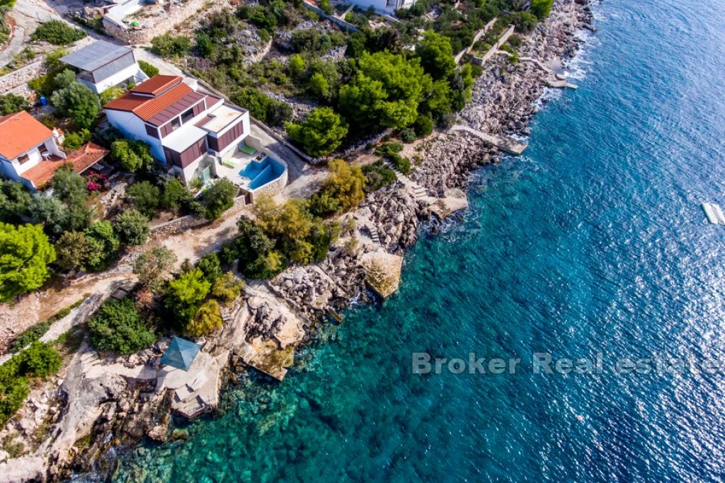 House first row by the sea