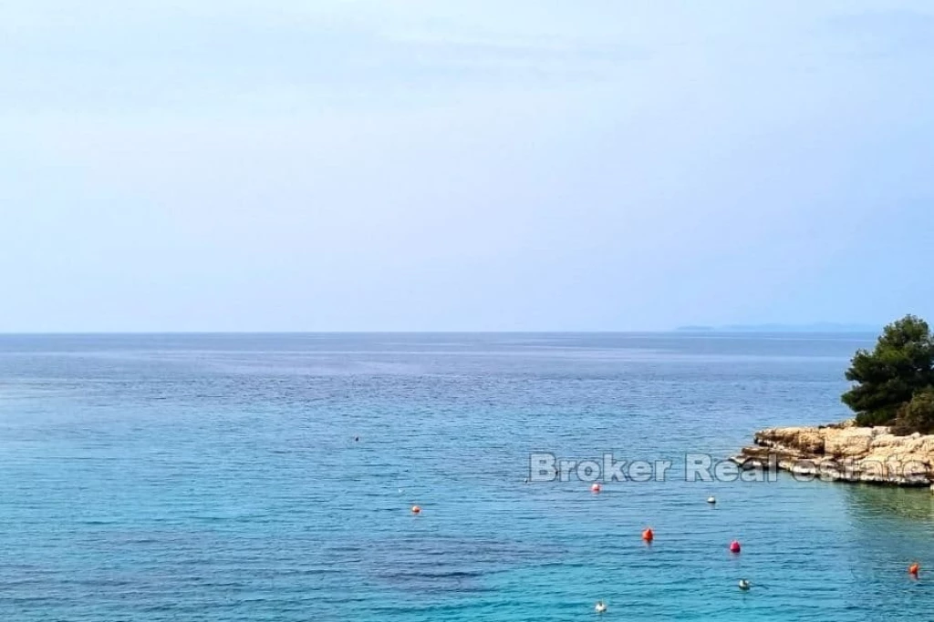 Building plot with project, first row to the sea