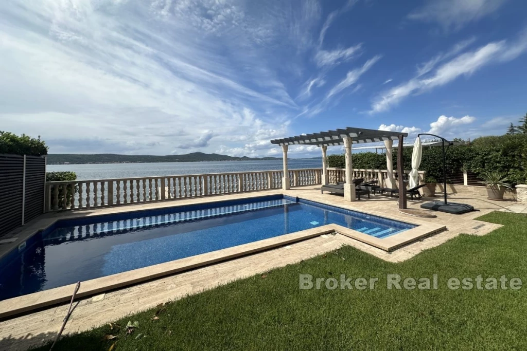 Luxury villa with building plot in the first row to the sea