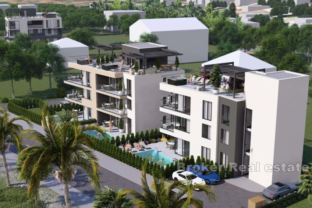 New construction with a roof terrace in the first row to the sea