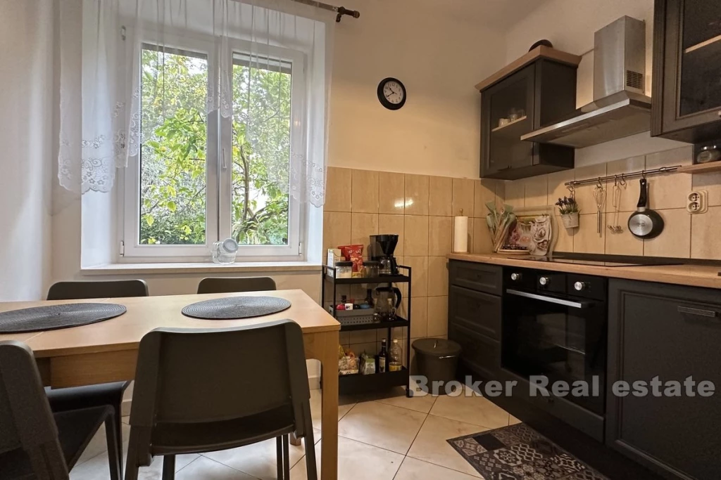 Spacious two-bedroom apartment with garden and garage