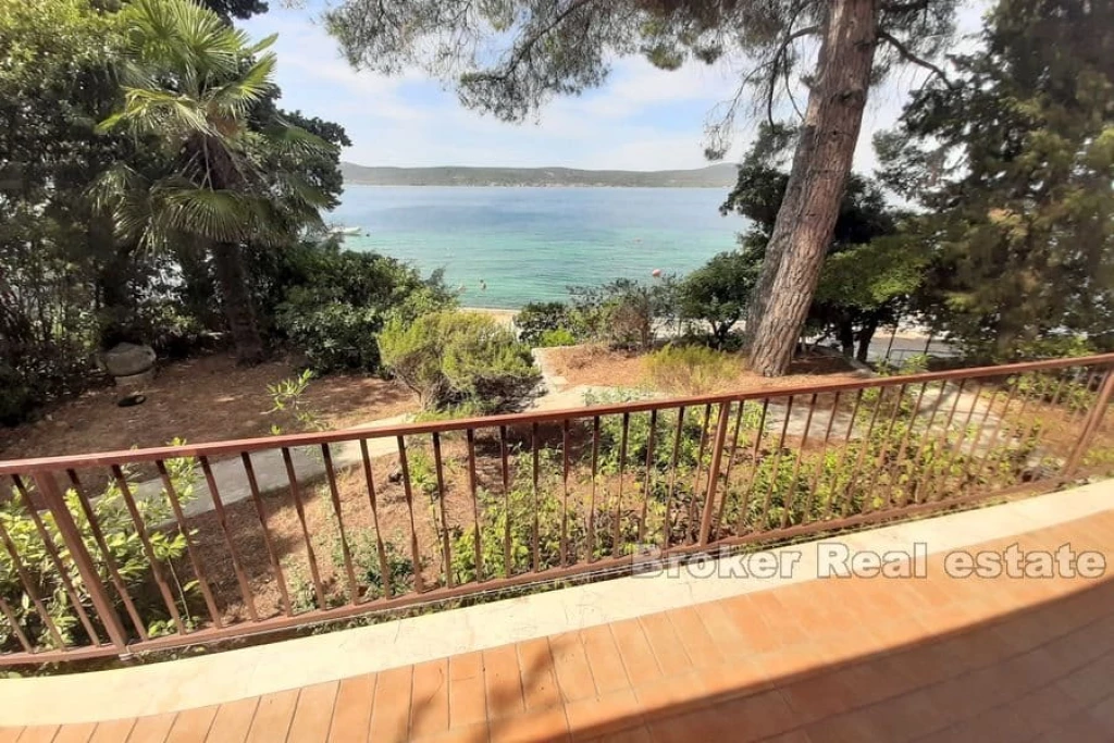 House in the first row by the sea