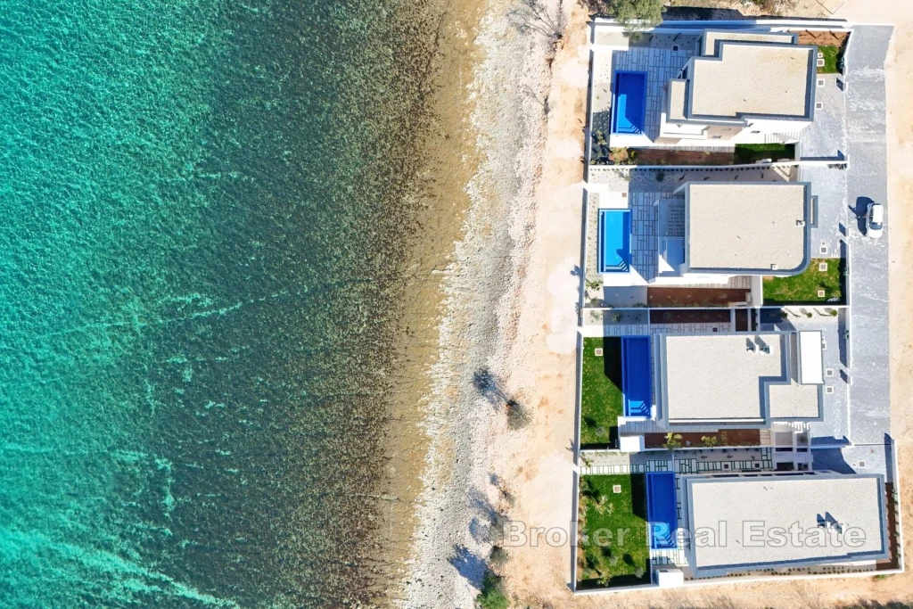 Modern villa in an exceptional location, first row to the sea