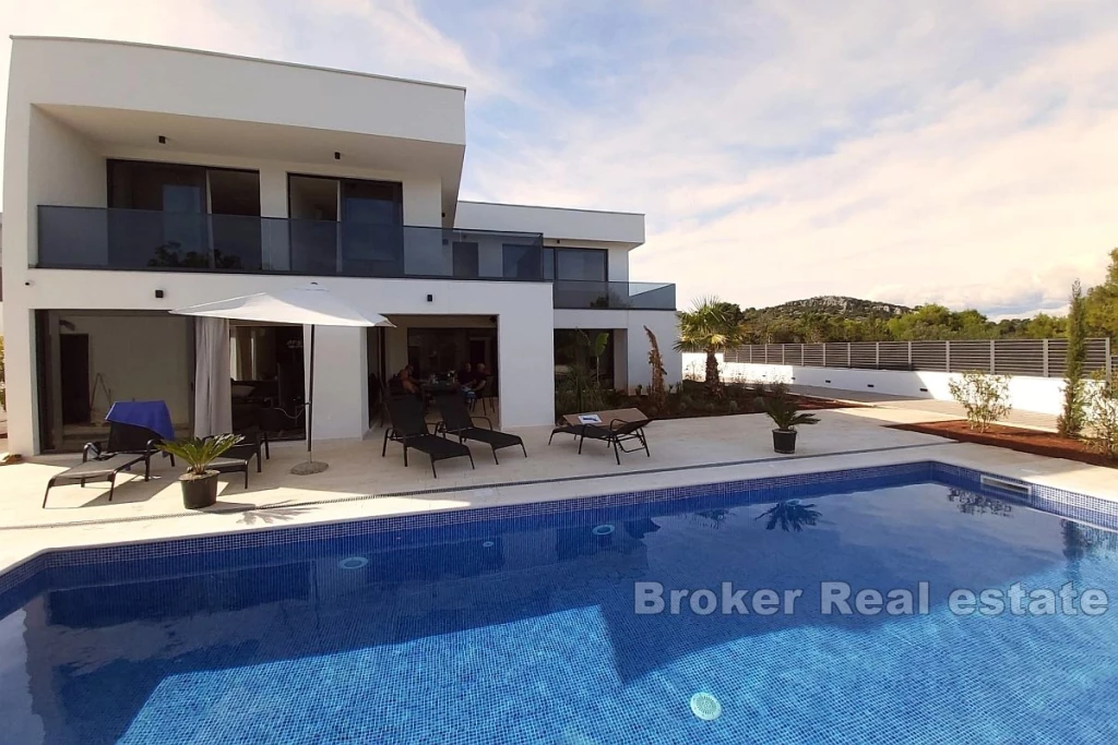 Newly built villa with a pool and a sea view