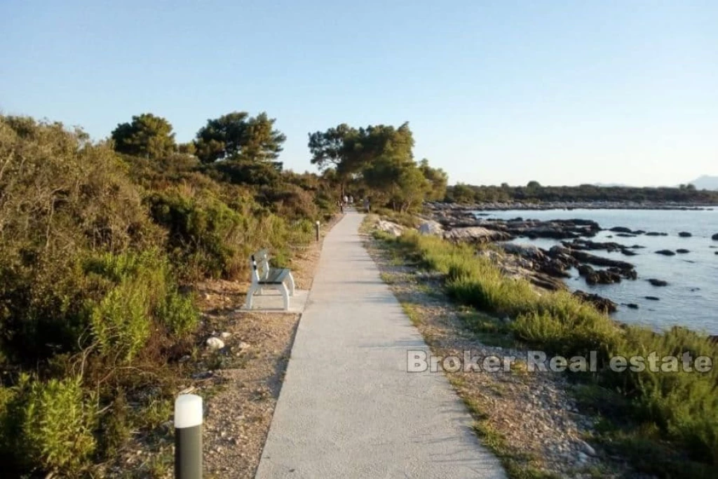 Land in the first row by the sea