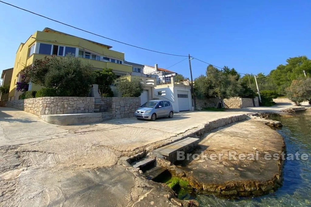 Apartment house first row to the sea