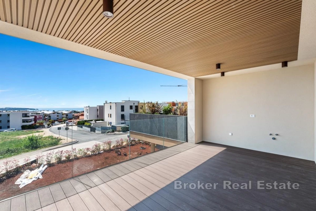 Modern two-bedroom apartment with a spacious terrace and sea view