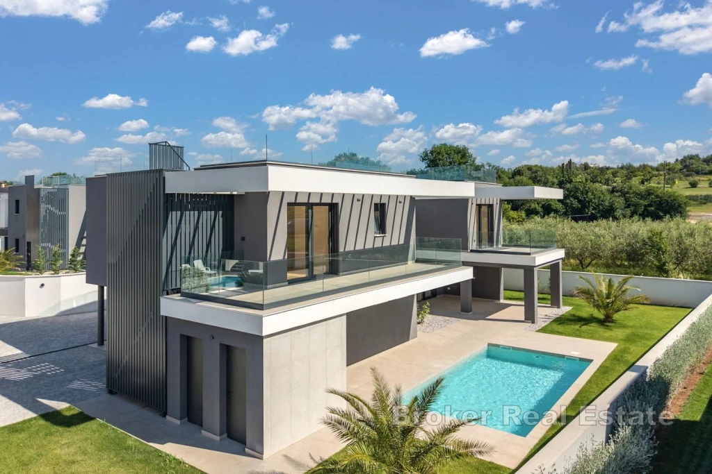 Modern coastal villa with heated pool and exclusive rooftop terrace