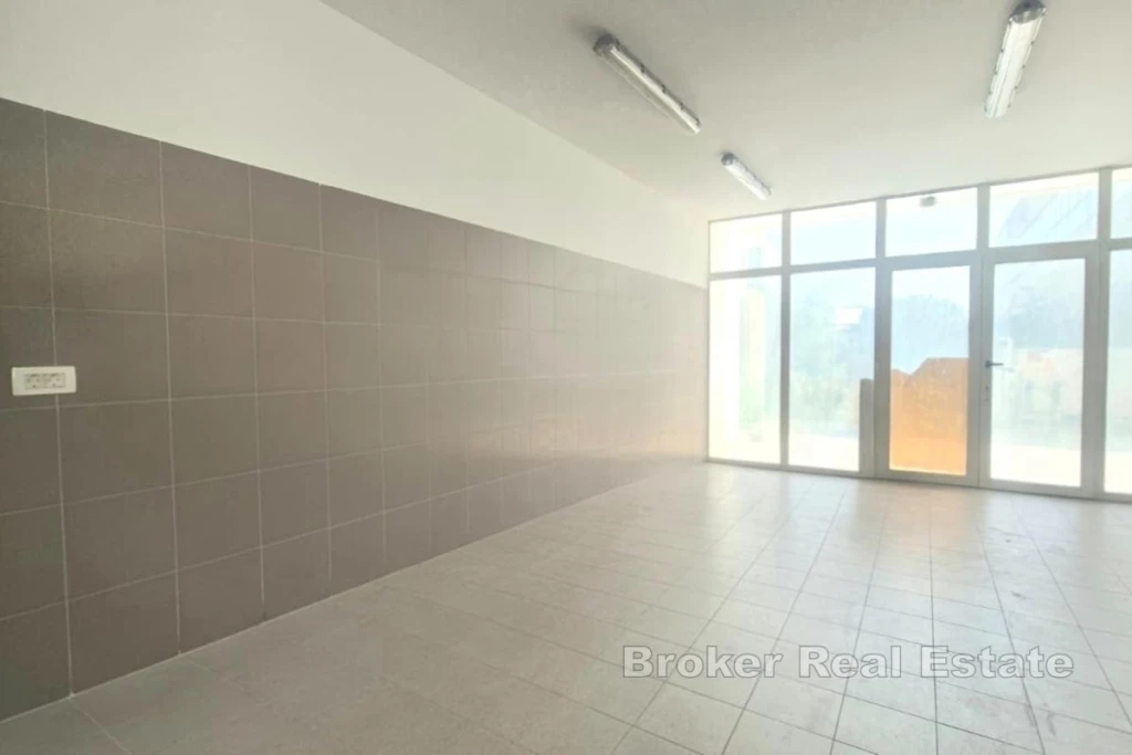 Commercial space on the ground floor of a building with two entrances