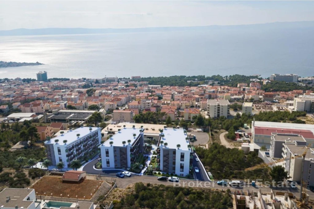 Modern three bedroom apartment in a new building with a coastal view