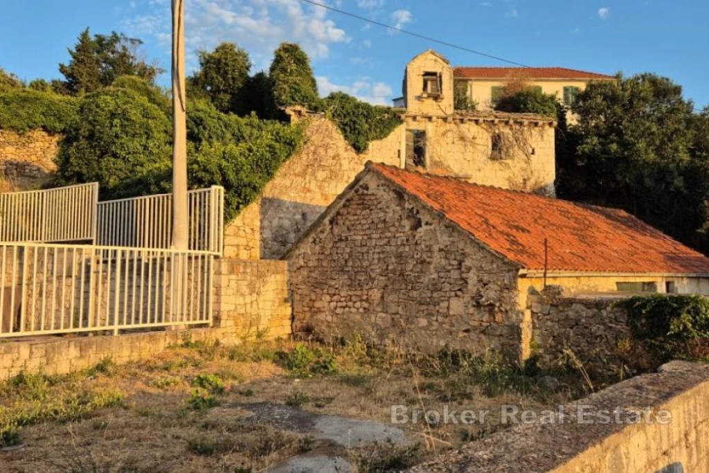 Ruined stone houses with garage and outbuildings