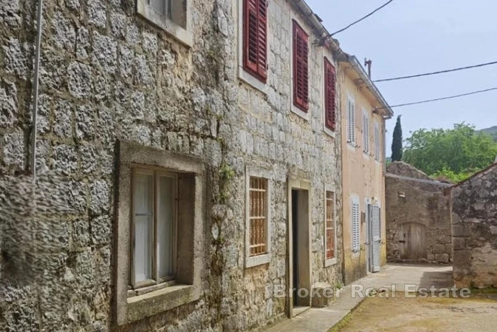 Stone house in row, for renovation, with outbuilding and garden