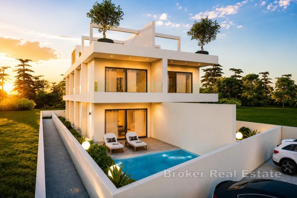 Luxury apartment first row to the sea with swimming pool and garden
