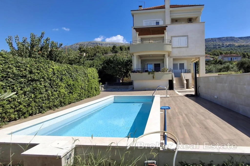 House with a pool and sea view