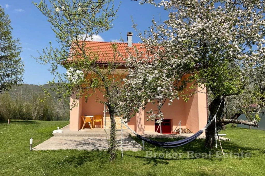 House in nature with a large garden
