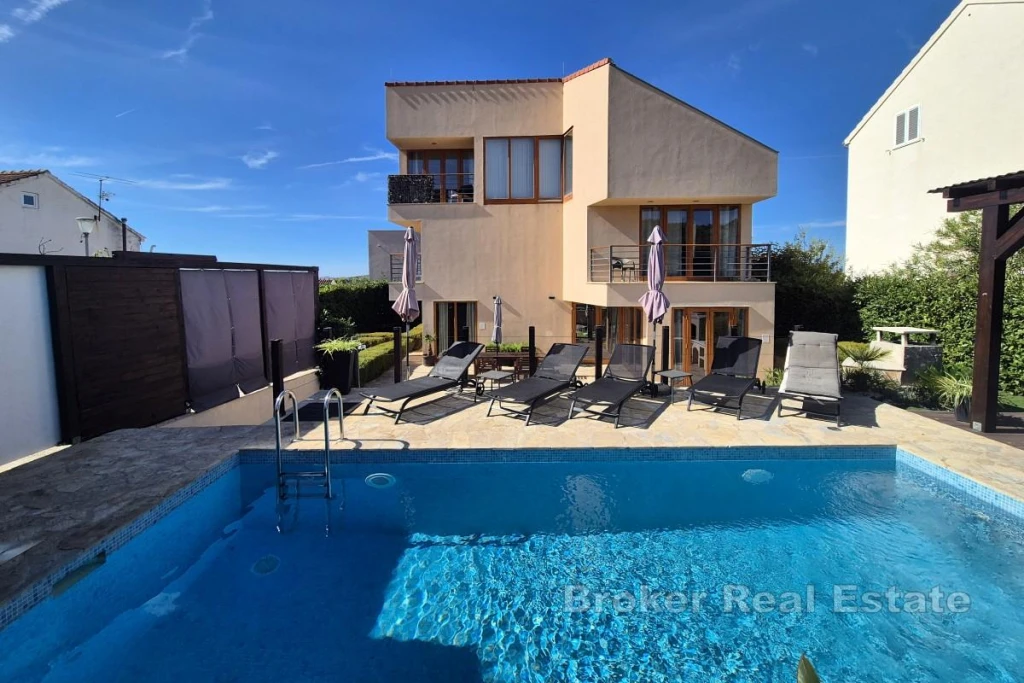 Attractive holiday home with a pool near the sea