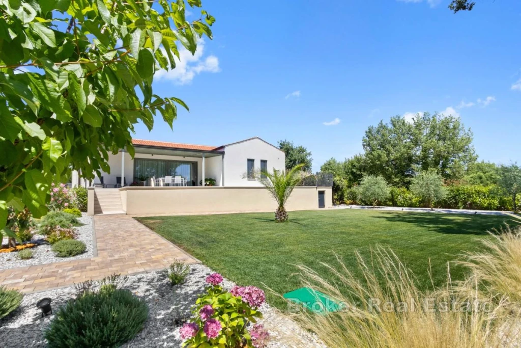 Modern Single-Story Villa with a Swimming Pool and Spacious Grounds